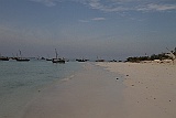 The lighthouse in the background is the northern tip of Zanzibar